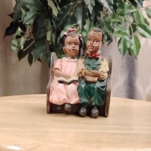 Charming Figurine of Children Sitting On A Pew